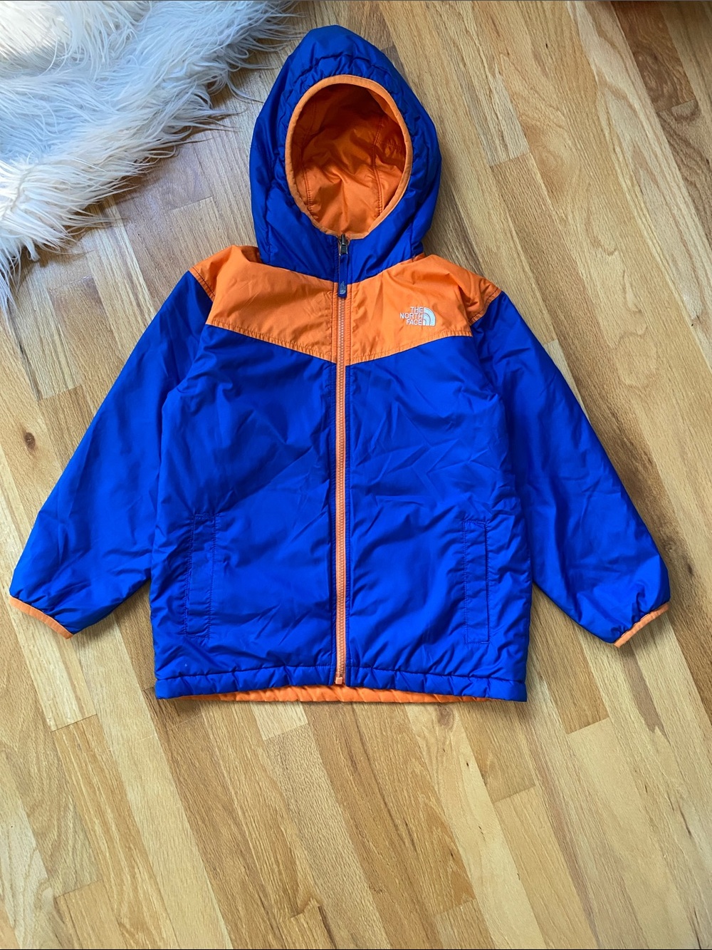 The North Face Kids Hooded Puffer Jacket in Blue & Orange Reversible Size 7/8